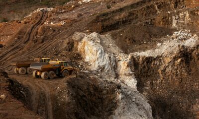 a large truck driving down a dirt road